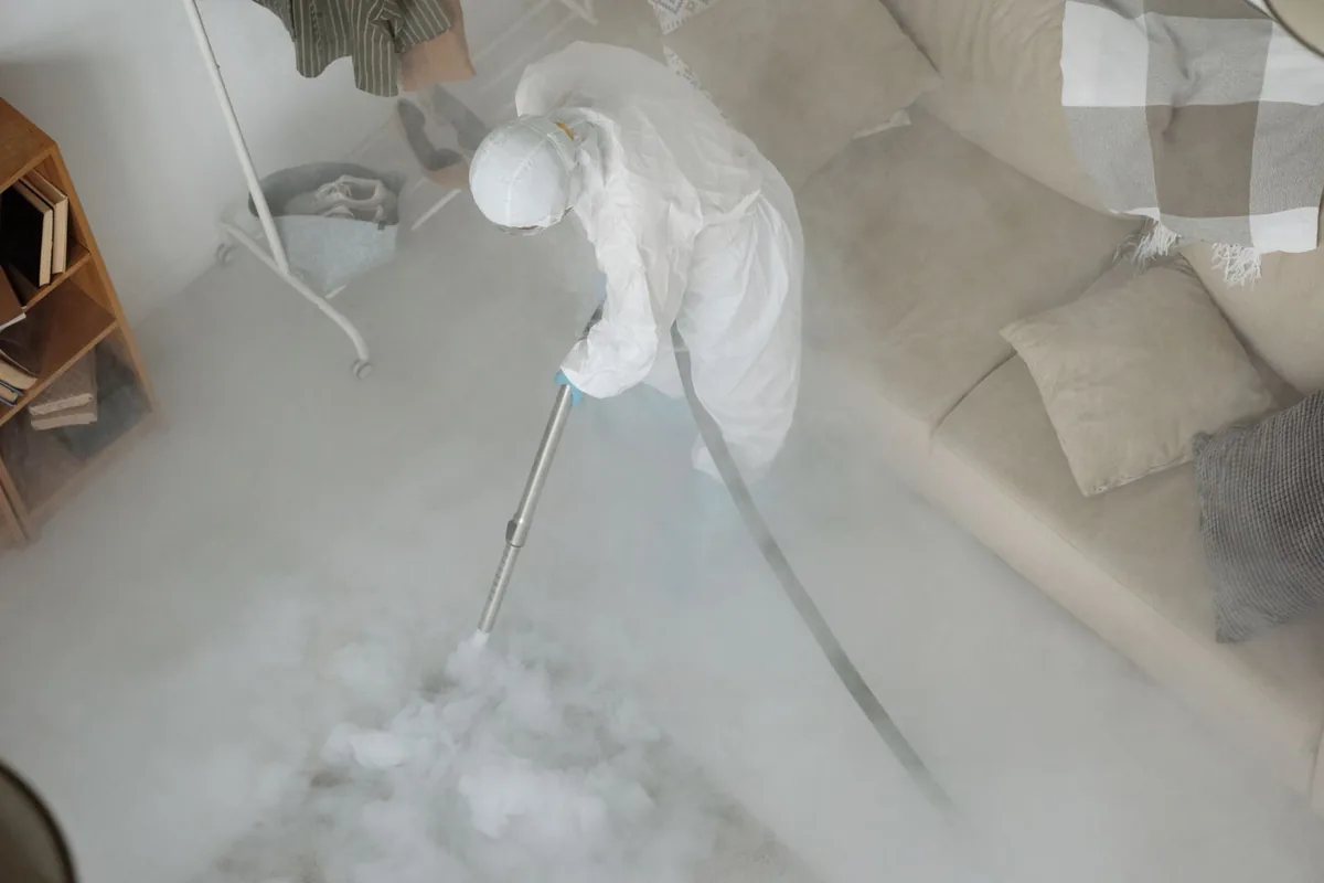 Biohazard cleanup technician in protective equipment, Nicholson, GA